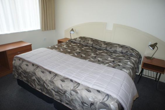 Three-Bedroom Unit - king-size bed